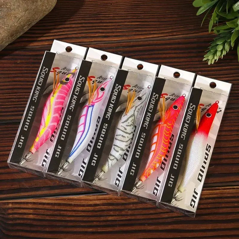 Set of six fishing lures in packaging on a wooden surface