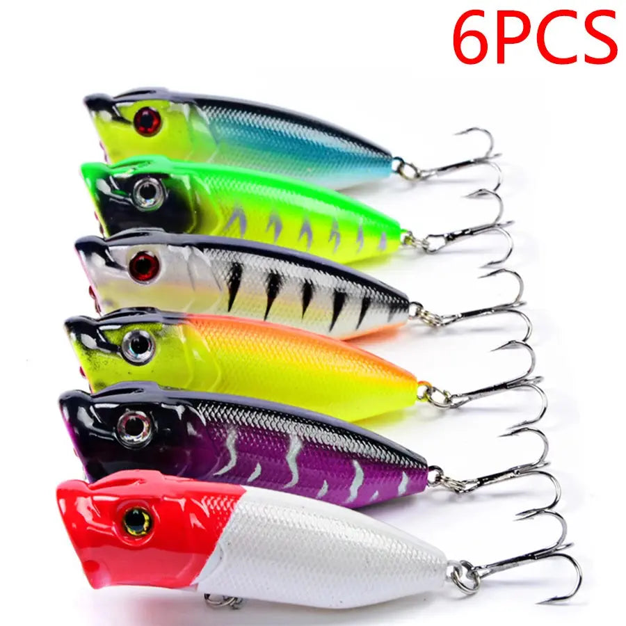 Set of six colorful fishing lures with '6PCS' text above on a white background